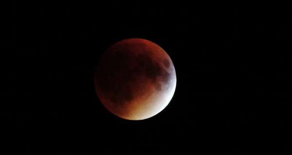 Why is the Moon red during a total lunar eclipse?